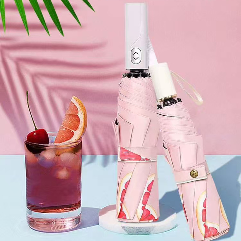 How does the vinyl pink triple-fold umbrella specifically contribute to portability?